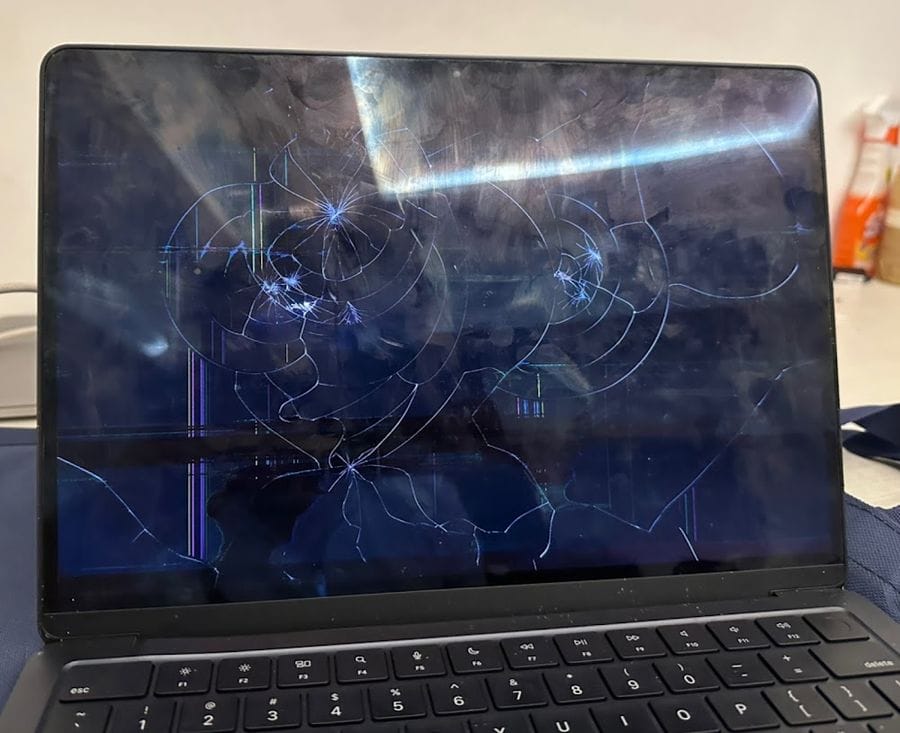 MacBook Air with a shattered and cracked display before repair at iProduct Repair, HSR Layout Bangalore