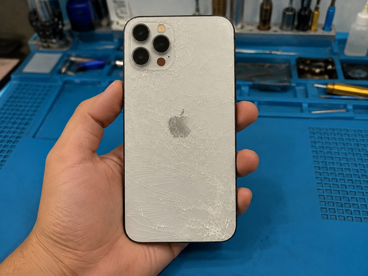 iPhone 12 Pro Max with shattered rear glass before back glass replacement at iProduct Repair, HSR Layout Bangalore